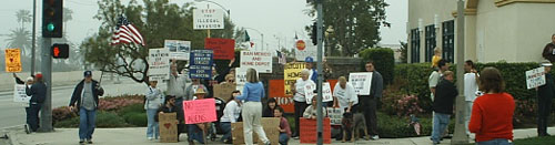 Protesters at the street corner in front of Home Depot